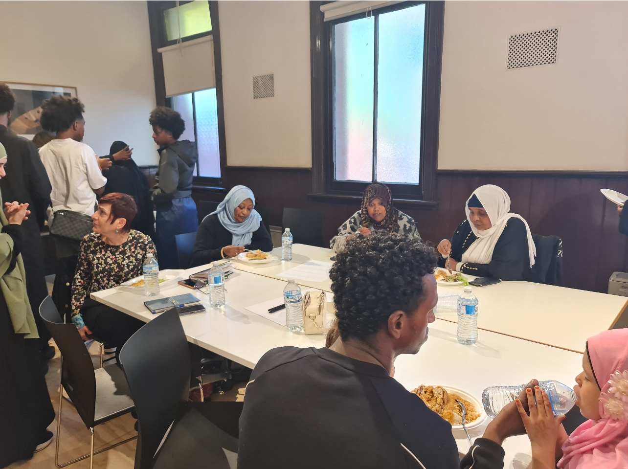 Community members and elders sharing a meal together at an SWDA gathering